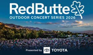 Outdoor concert scene for RedButte Outdoor Concert Series 2026 with a large audience and a stage set against hills at dusk, Presented by Toyota
